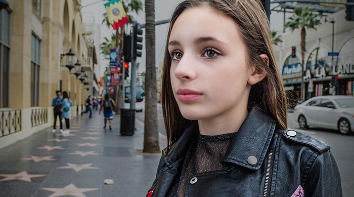 Aja standing in Hollywood