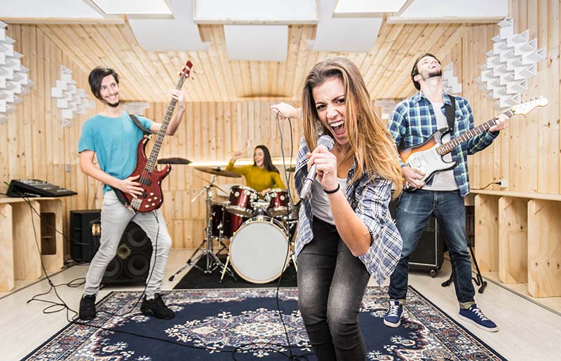 Rock band practicing in a sound studio