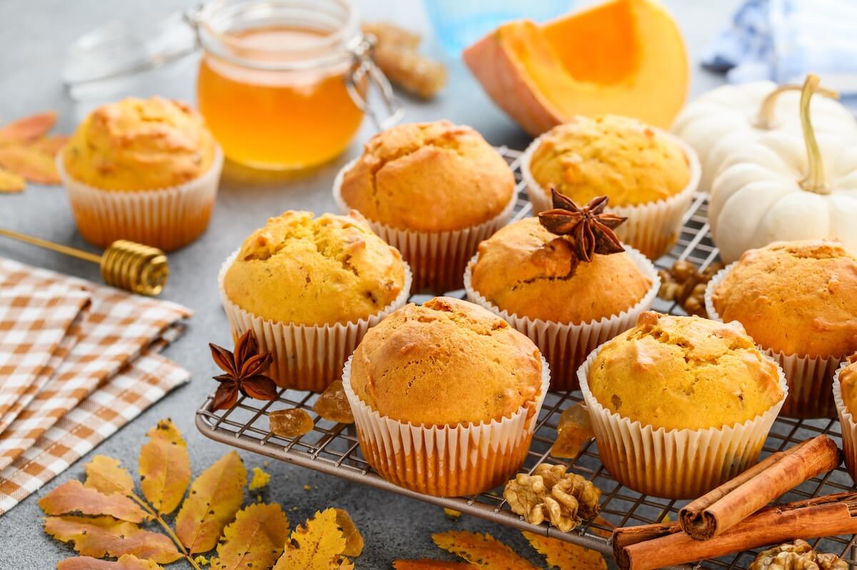 Shutterstock: Spicy squash muffins or cupcakes with walnuts on a metal rack. Autumn dessert. Selective focus
