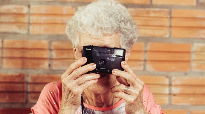 old lady taking a picture