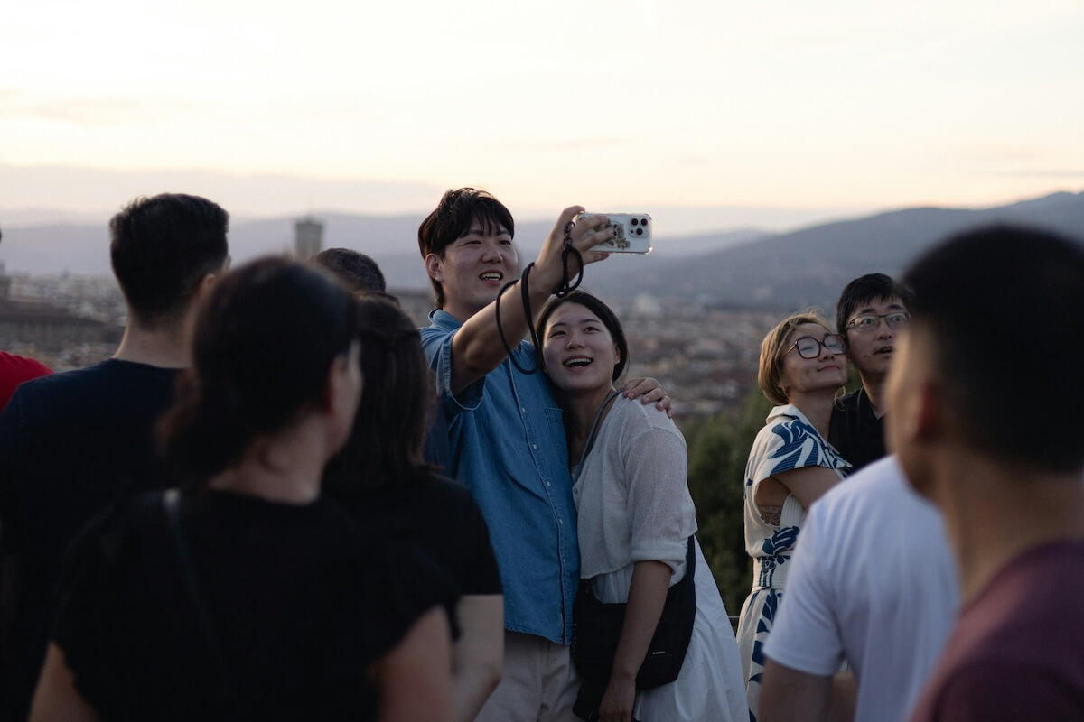 Unsplash: Travelers taking selfie by Vladimir Ivkenko
