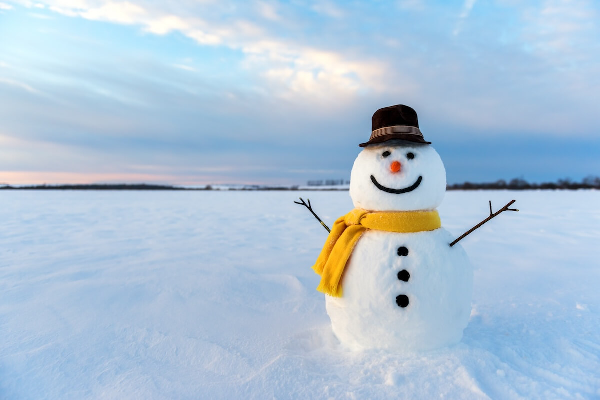 Shutterstock: snowman on orange sunset background