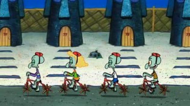 Squidward riding his bike with other squids that look just like him on an episode of SpongeBob SquarePants