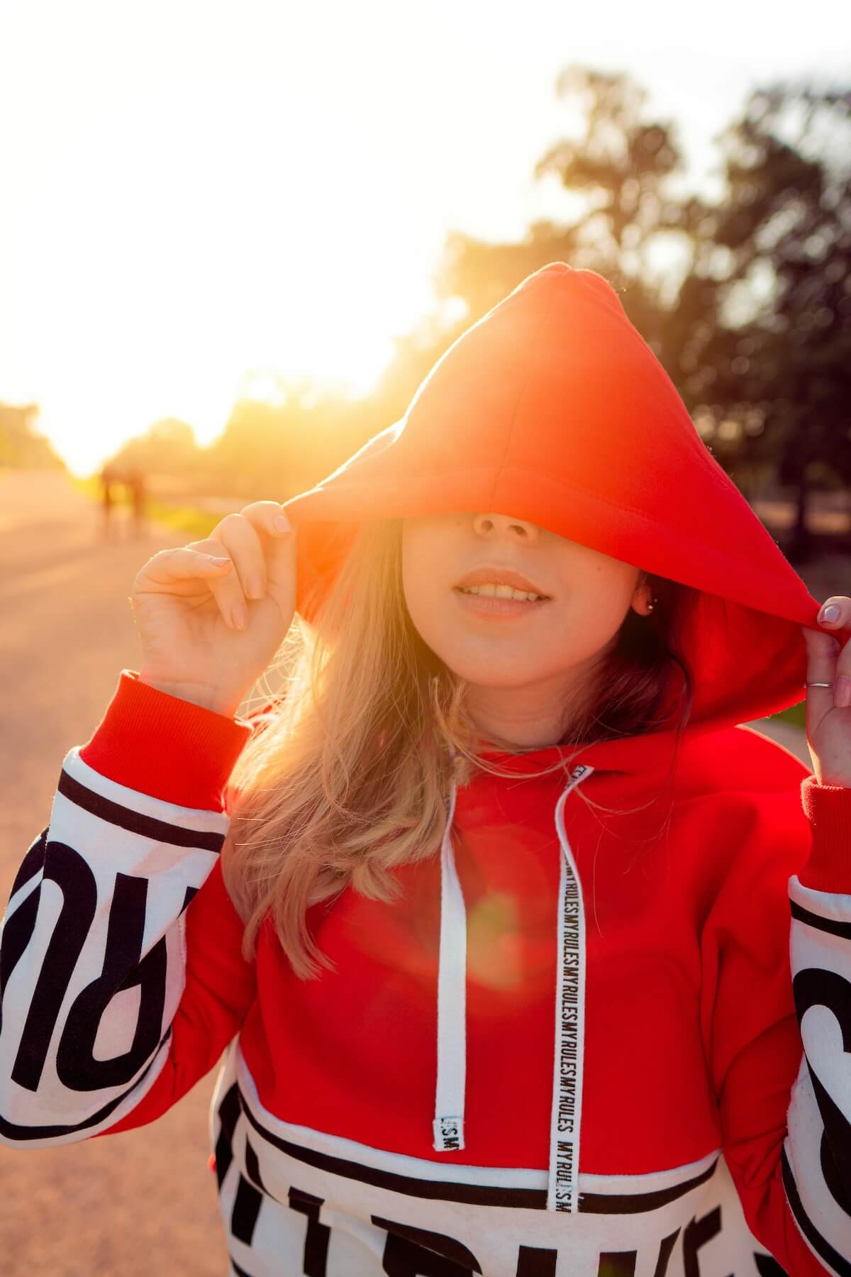 Unsplash: Woman in red hoodie by hassan ouajbir