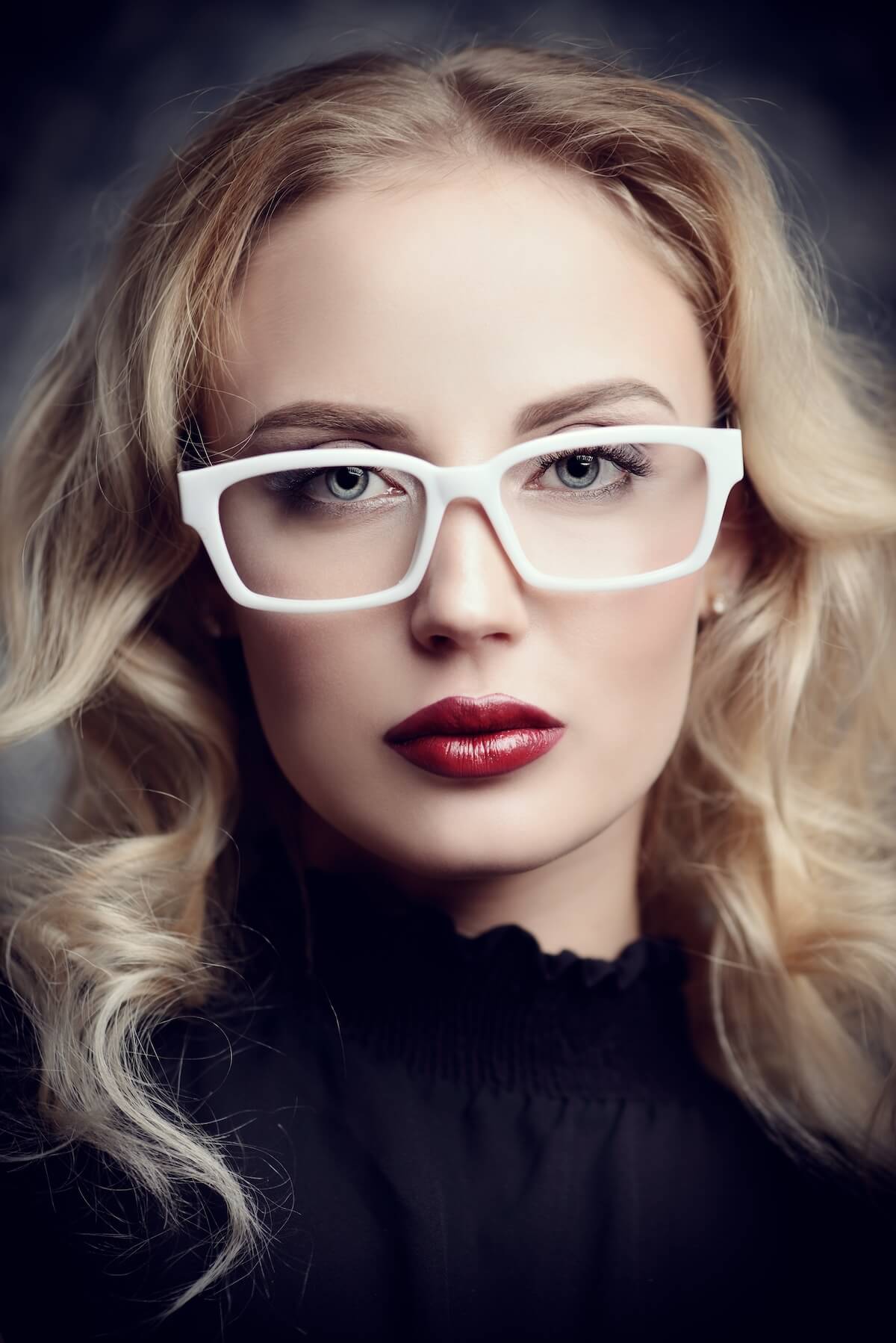 Shutterstock: Beauty portrait. Attractive young woman in glasses with bright make-up. Optics style. Cosmetics and make-up.