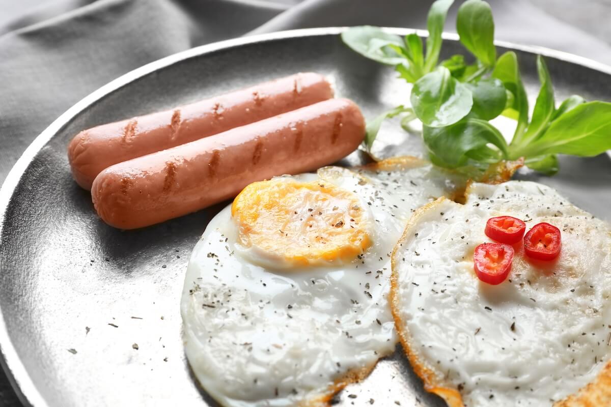 Shutterstock: Delicious breakfast with over hard eggs, closeup