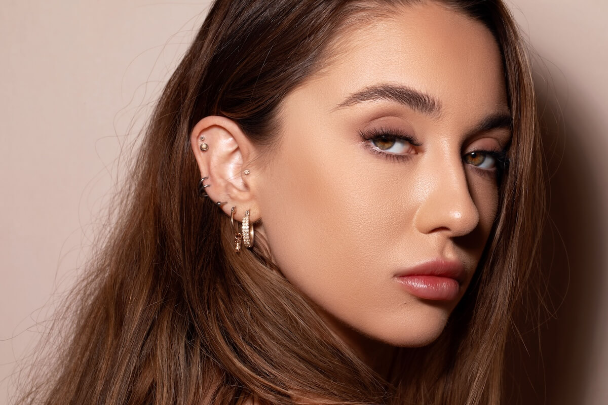 Shutterstock: A portrait of beautiful white girl with gentle makeup and ear piercings