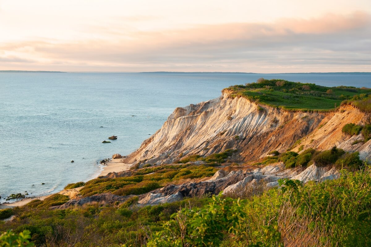 Adobe Stock: Sun sets illunimating sandy cliffs of Moshup Beach in Aquinnah, on Martha's Vineyard island, in Massachusetts. It is a favorite attraction for tourists looking for a spiritual connection.