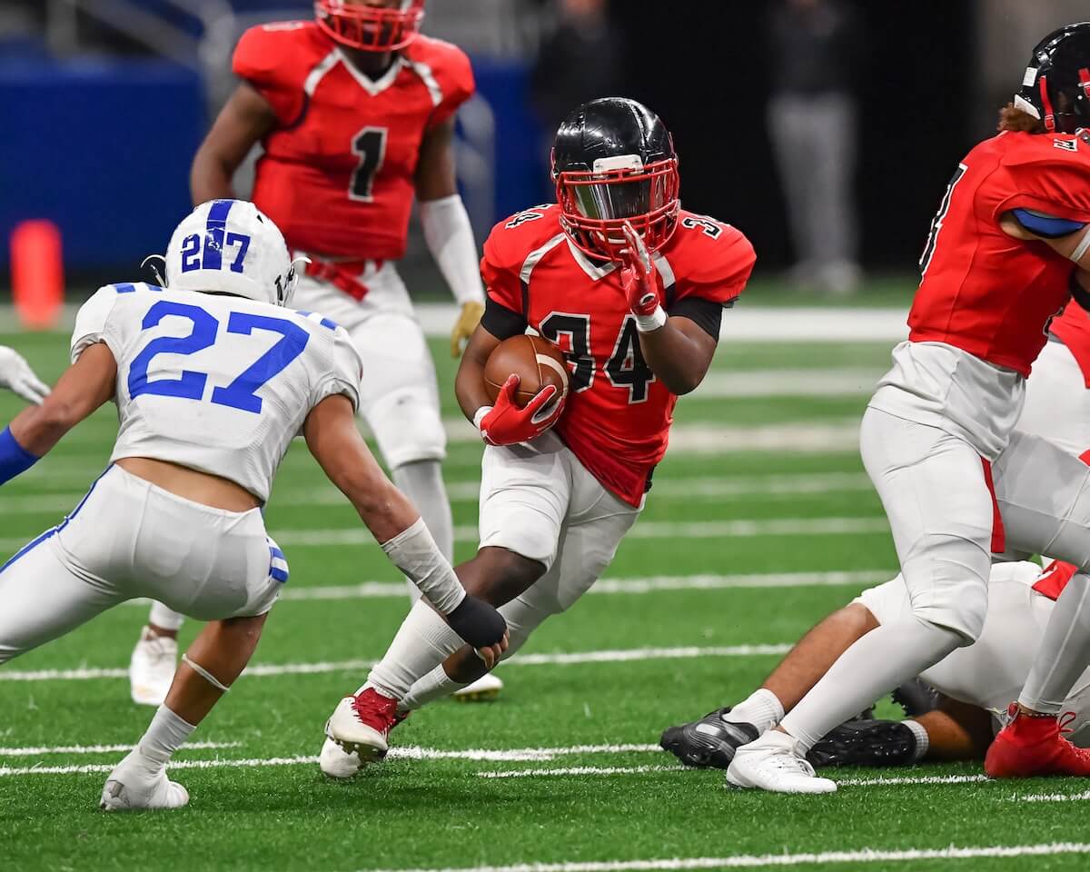 Shutterstock: Great action photos of high school football players making amazing plays during a football game