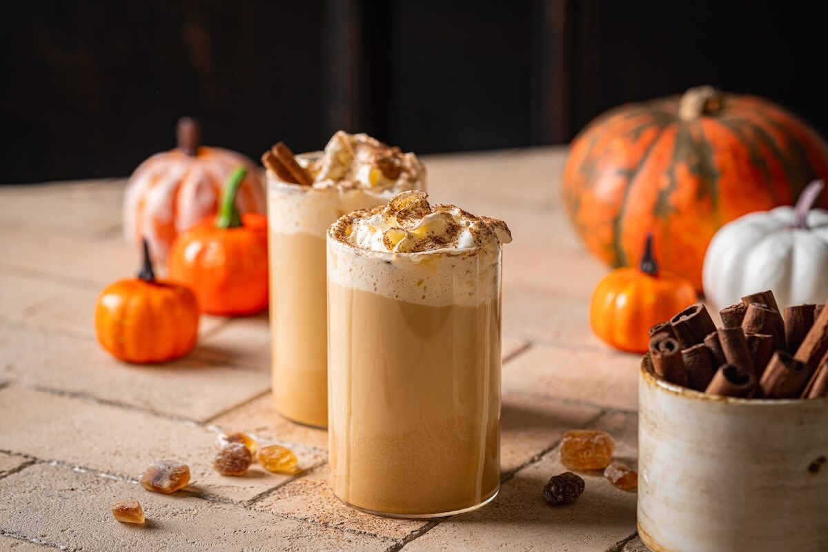 Shutterstock: Autumn pumpkin spice latte with whipped cream and cinnamon on dark background
