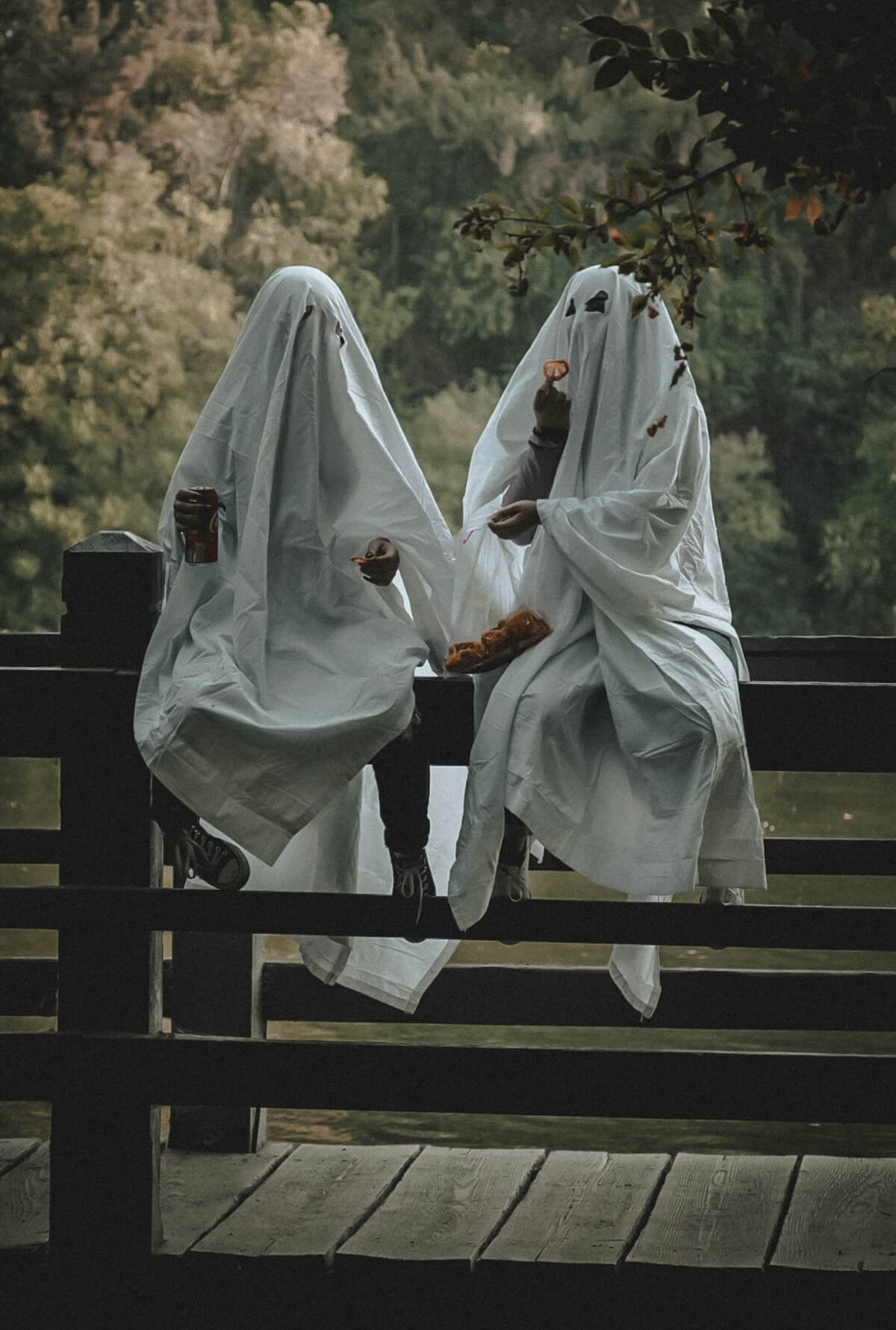 Unsplash: Couple dressed as sheet ghosts by Thalia Ruiz