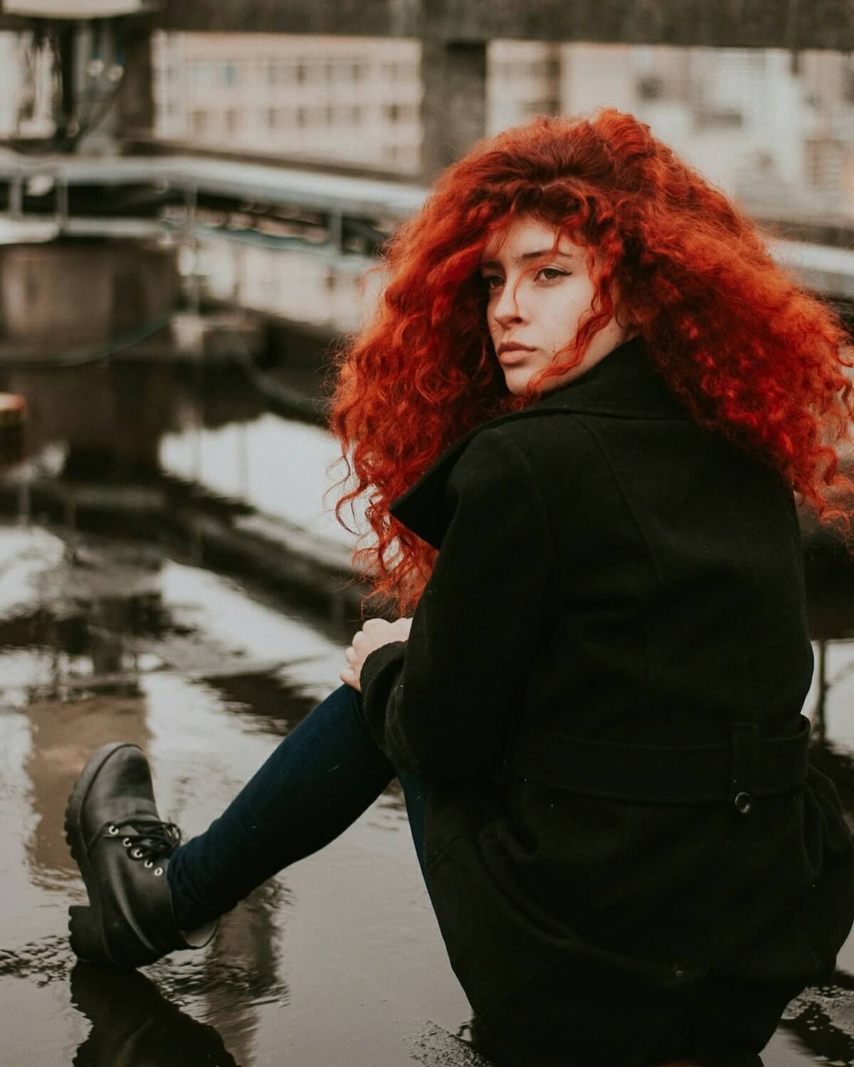 Unsplash: Woman with big red curly hair by pietra schwarzier