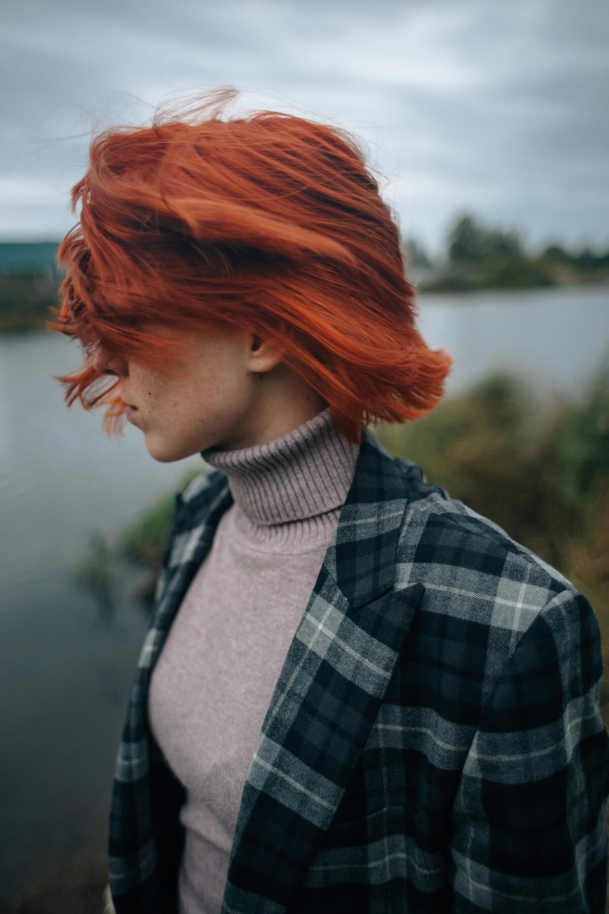 unsplash: woman with cropped red hair by ivy shirn