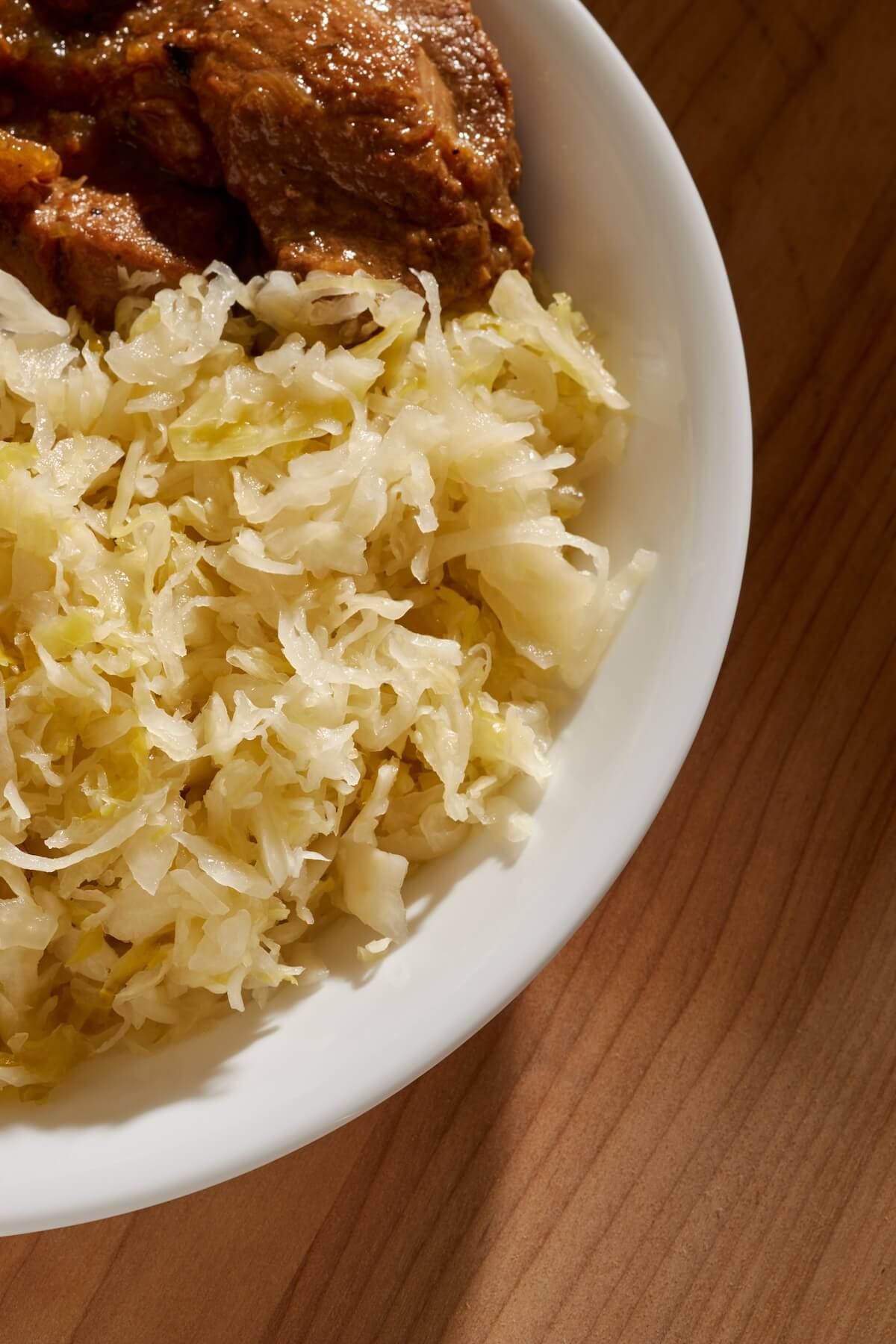 Shutterstock: Pennsylvania Dutch style braised pork and sauerkraut, a traditional dish on New Year's Day