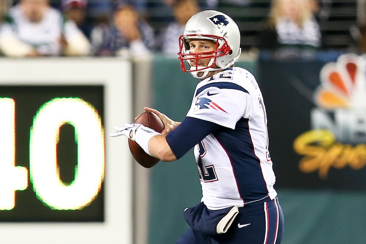 Shutterstock: EAST RUTHERFORD, NJ - NOV 22: New England Patriots quarterback Tom Brady looks to throw a pass against the New York Jets at MetLife Stadium on November 22, 2012 in East Rutherford, New Jersey.