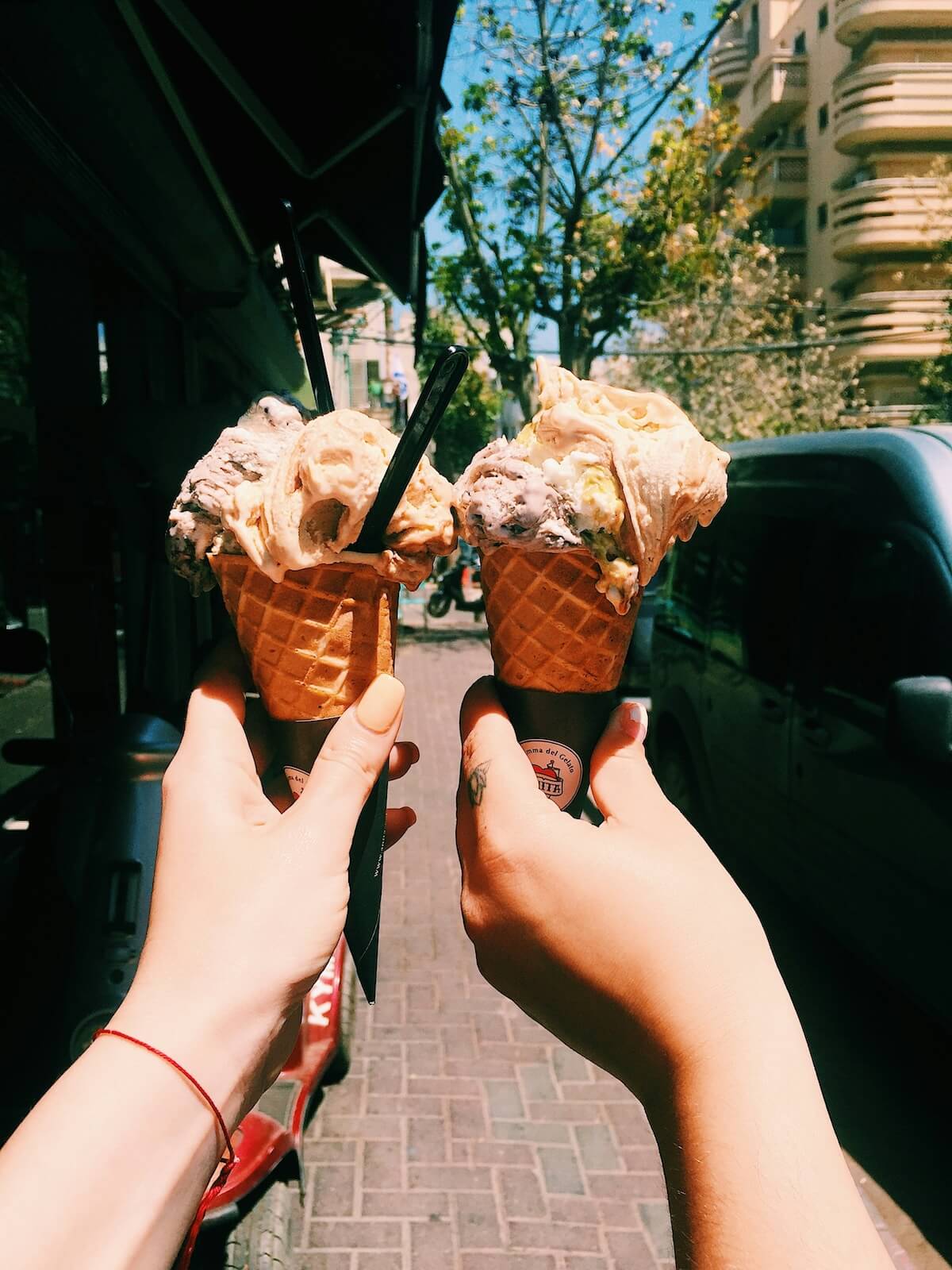 Unsplash: Friends holding up ice cream cones