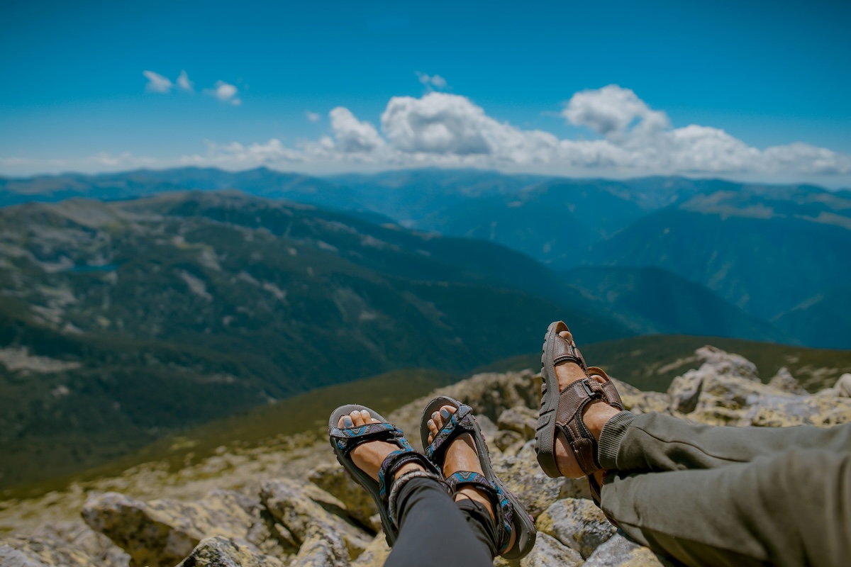 Unsplash: Couple's feet resting after hike by Toa Heftiba