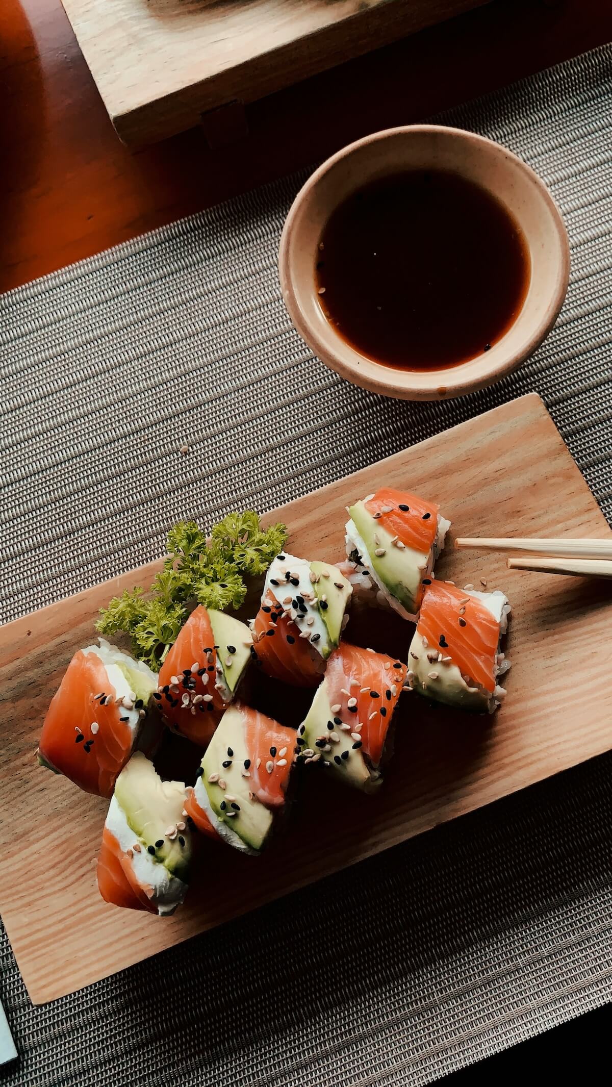 Unsplash: Plate of pretty sushi rolls by derek duran