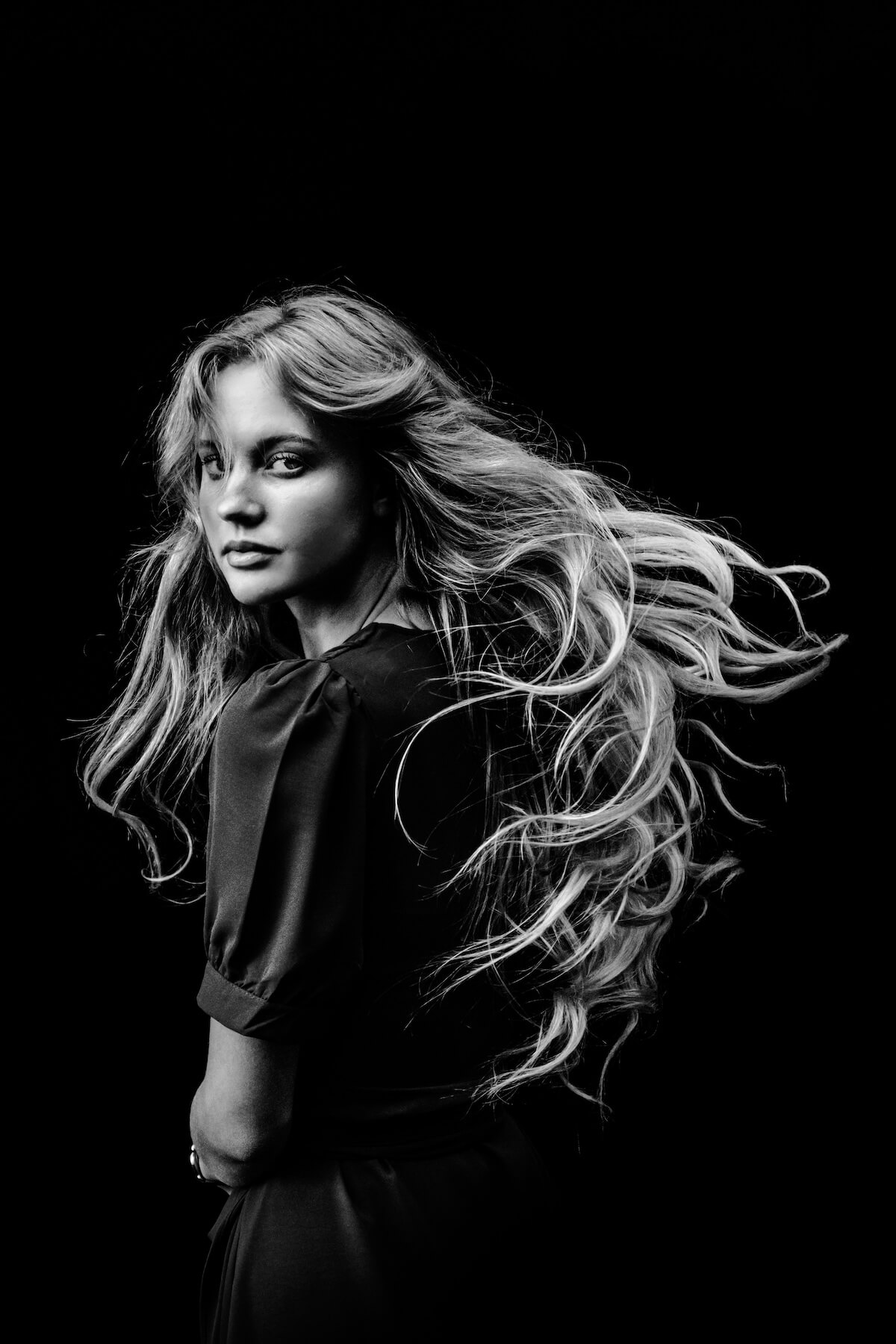 Unsplash: Woman with long blonde hair in black and white by Todd Trapani
