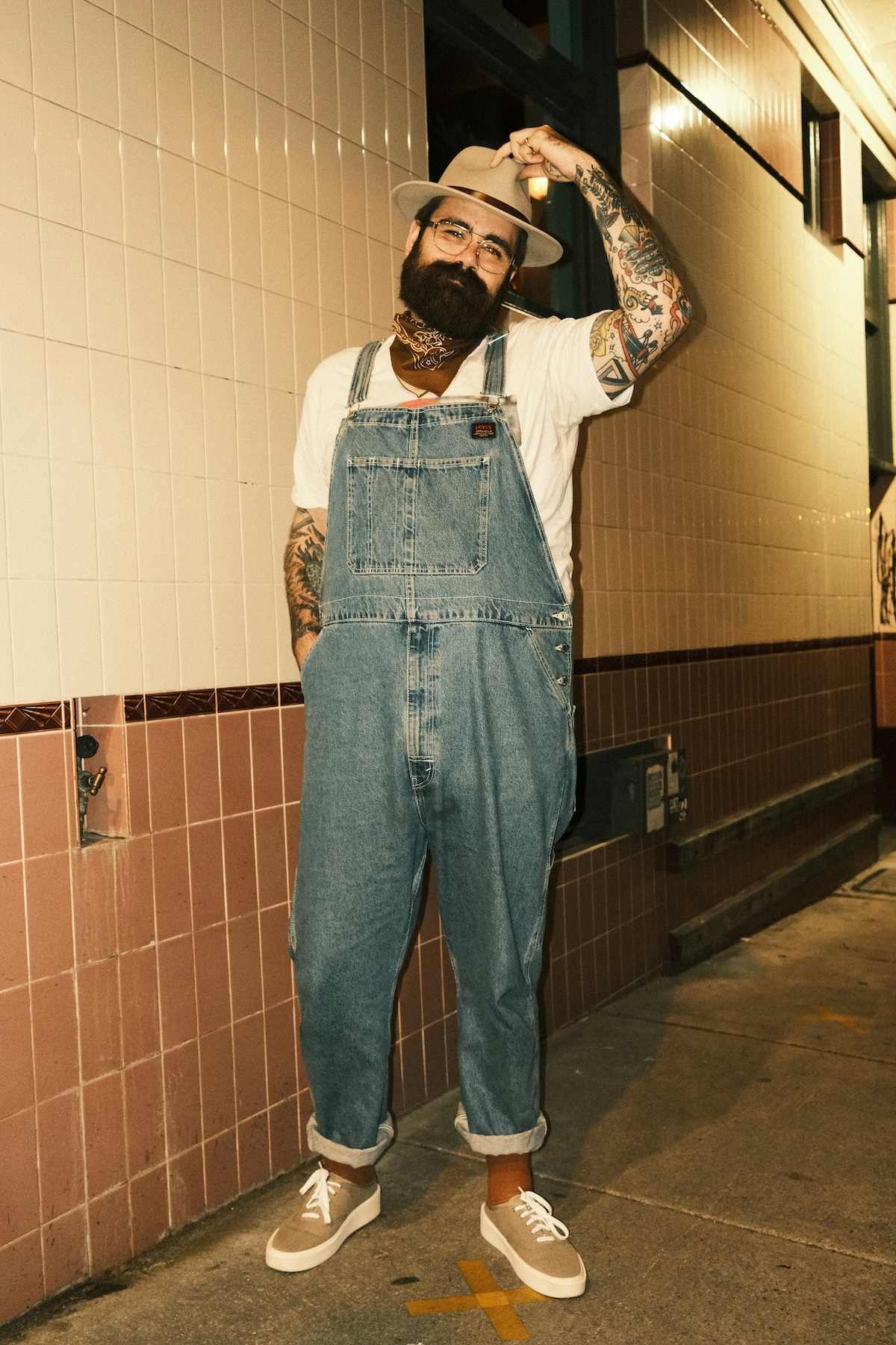 Unsplash: Man in hat and overalls by Jay Wennington