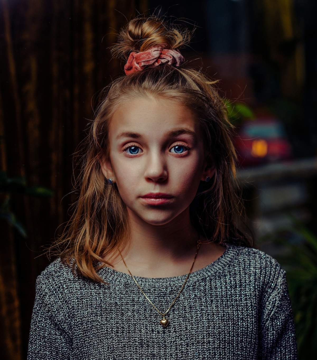 Unsplash: Scrunchie on top of young woman's head by Janko Ferlic