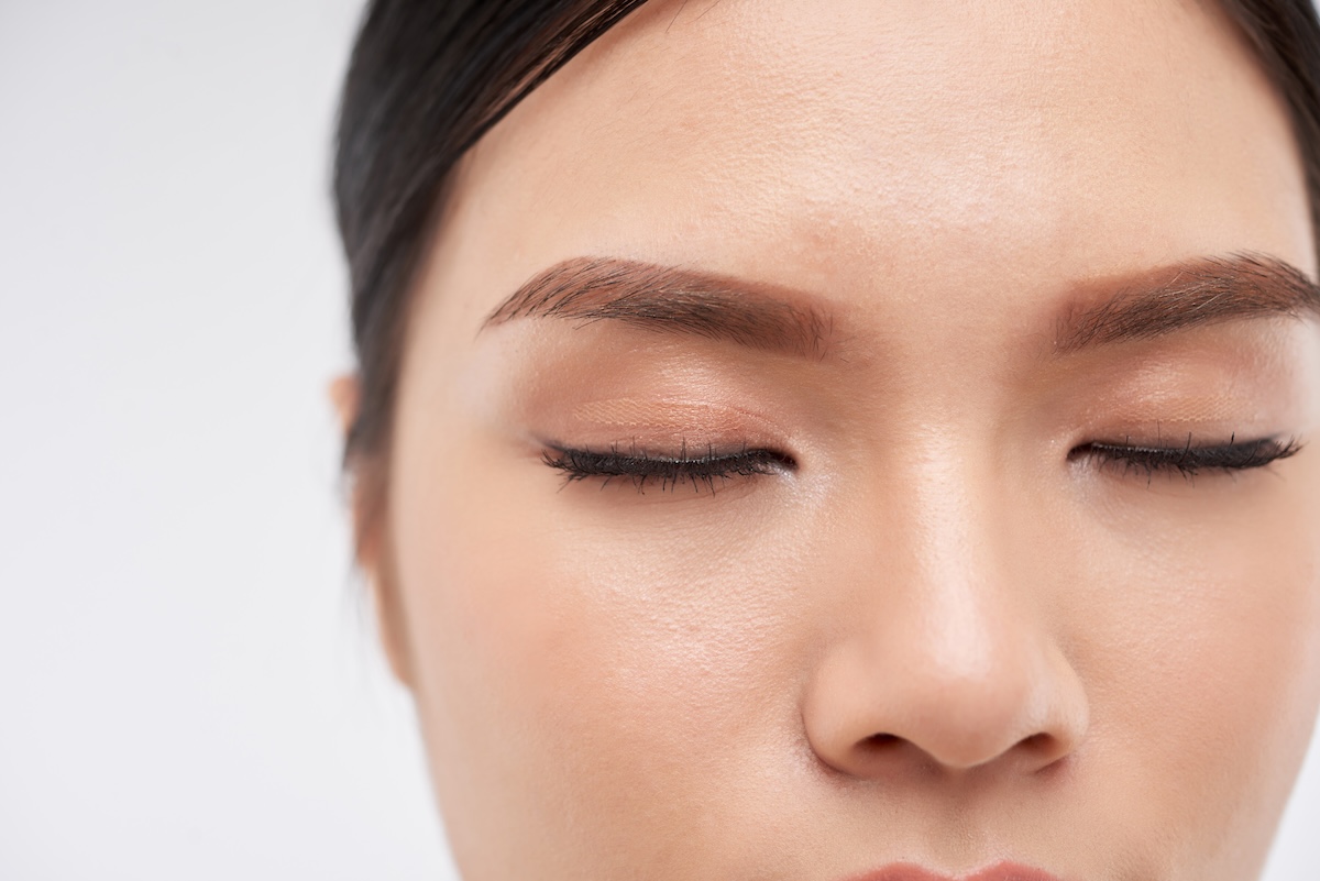 Shutterstock: Close-up image of young woman with nude make-up with foundation, false lashes and eyebrow tint