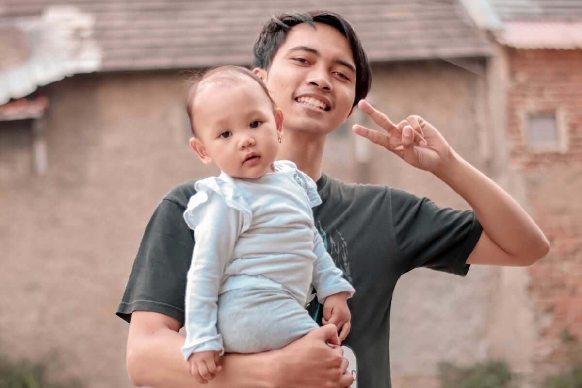 Unsplash: man taking funny selfie with baby by Rahadiansyah