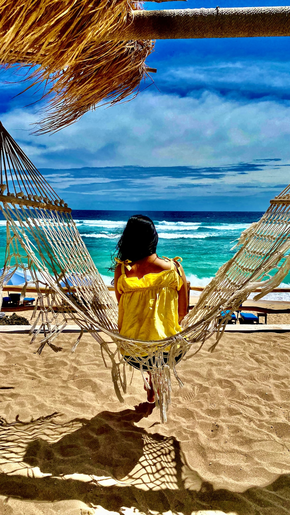 Unsplash: Woman in beach hammock by Jun Verbeet