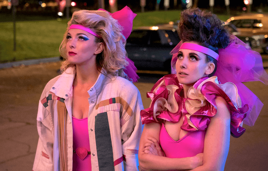 GLOW: Characters in pink wrestling costumes
