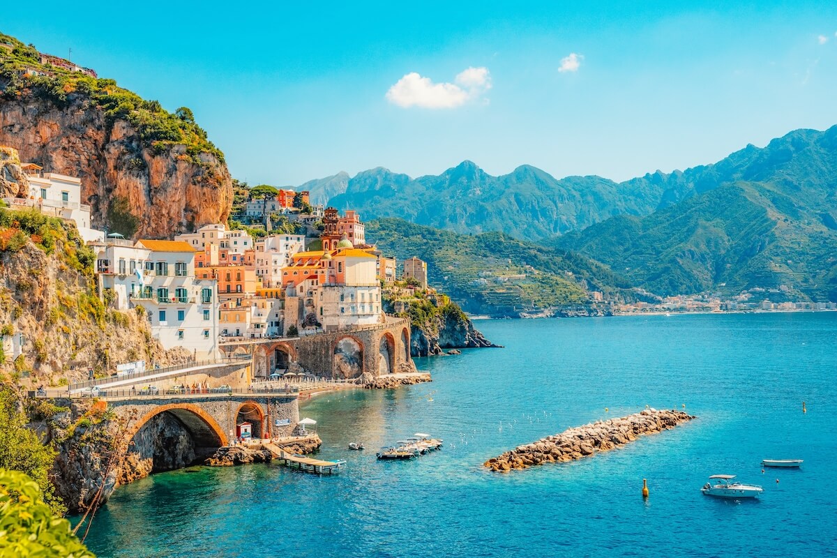 Shutterstock: Atrani famous coastline in southern Italy, vertiginous cliffs adorned with colorful villages, turquoise waters. Small town Atrani on Amalfi Coast in province of Salerno, Campania region, Italy