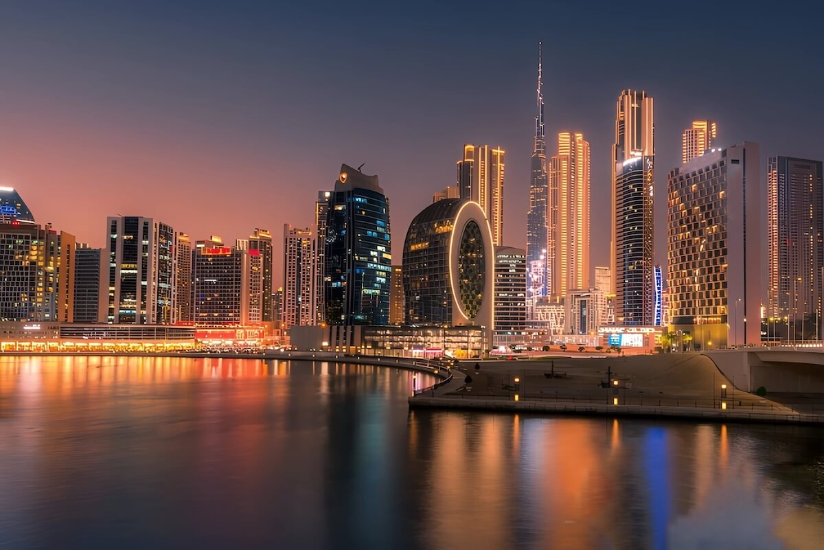 Shutterstock: Dubai at night is a mesmerizing blend of luxury and innovation. Watch as the city's skyline glows with towering skyscrapers, bustling souks, and the tranquil waters of the Dubai Marina reflecting a th