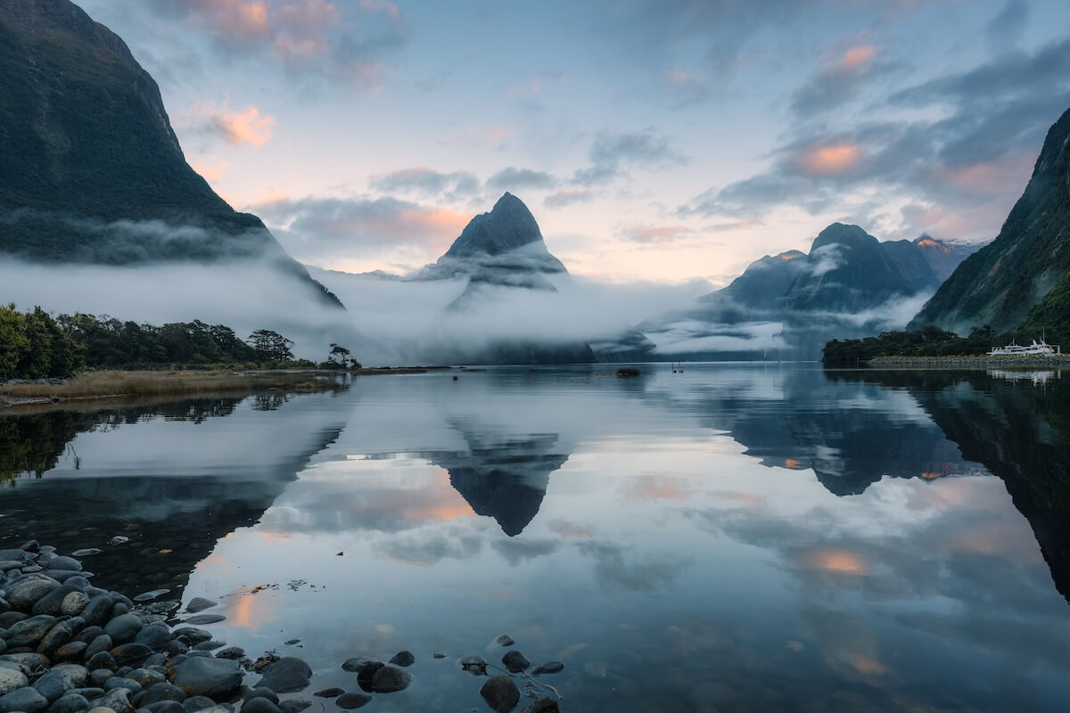Shutterstock: Mysterious landscape of Milford Sound or Rahotu with Mitre peak and foggy on the lake at Fjordland national park, New Zealand