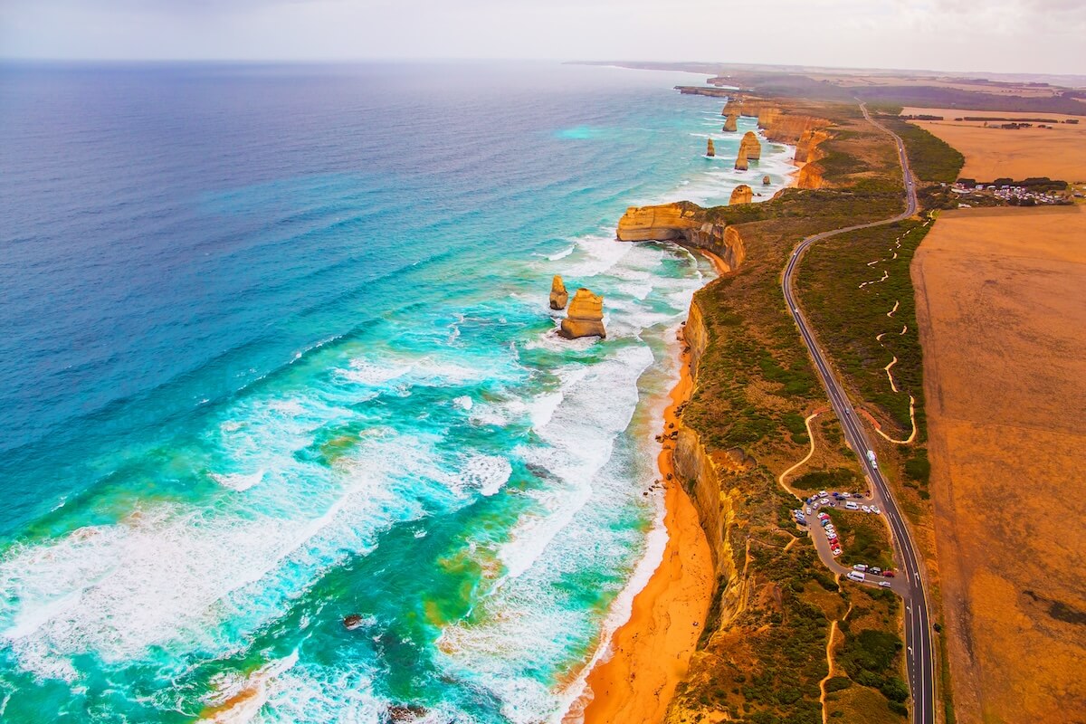 Shutterstock: The Twelve Apostles are a group of limestone rocks in the Pacific Ocean near the coast. Australia. Aerial view. Great Ocean Road. Helicopter flight over the scenic Pacific coastline.