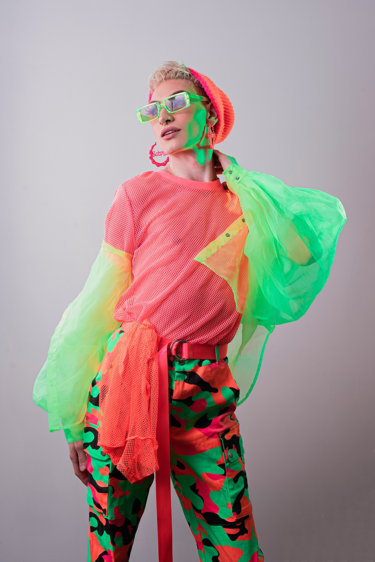 Unsplash: Woman in neon red and green by Brian Lawson