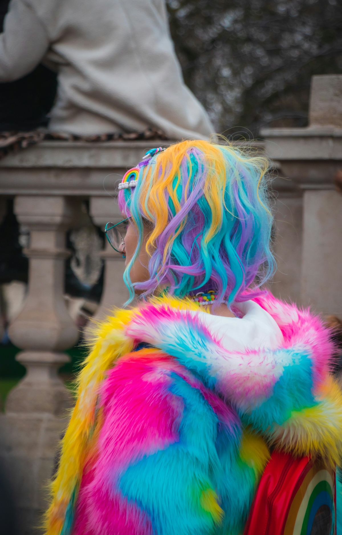Unsplash: Woman with colorful hair and coat by Tommy Van Kessel