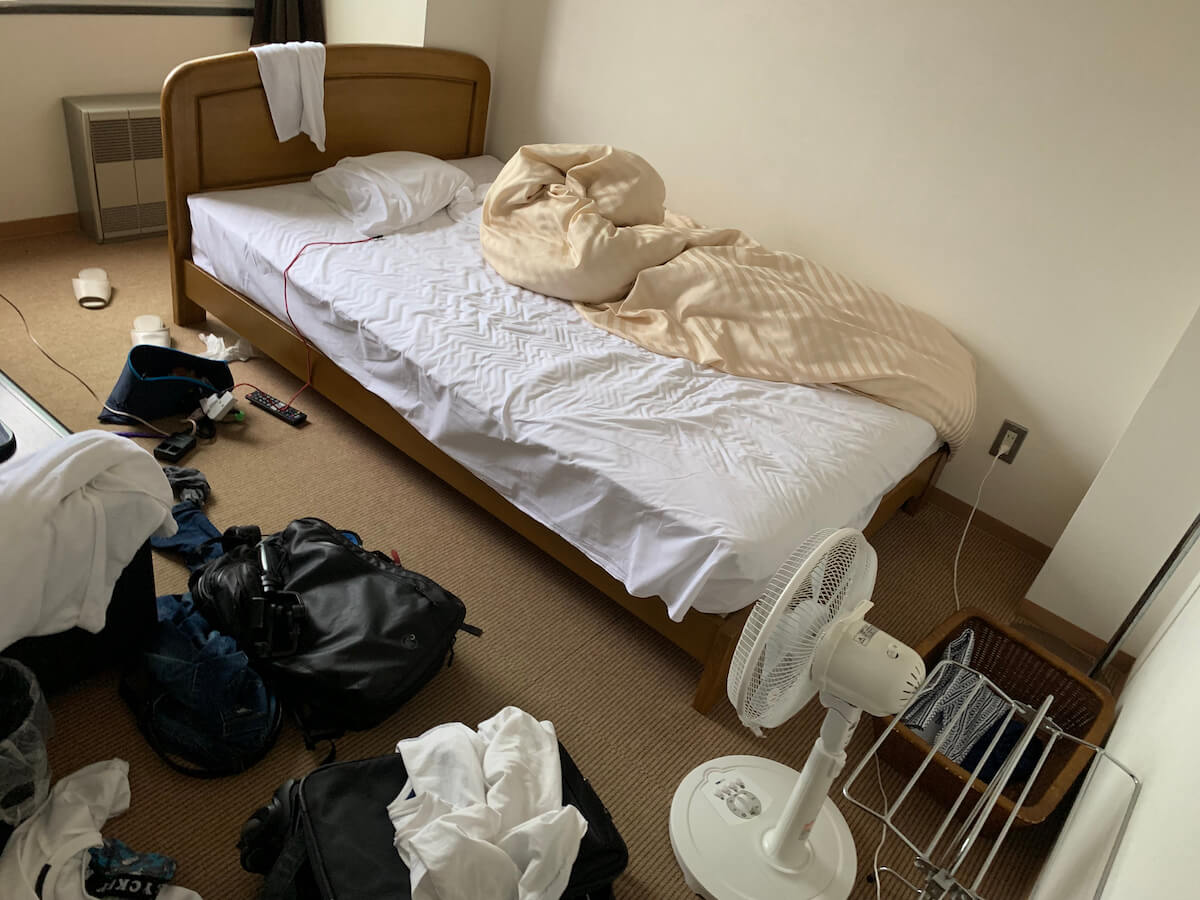 Shutterstock: Roommate leaving messy bed in dorm room