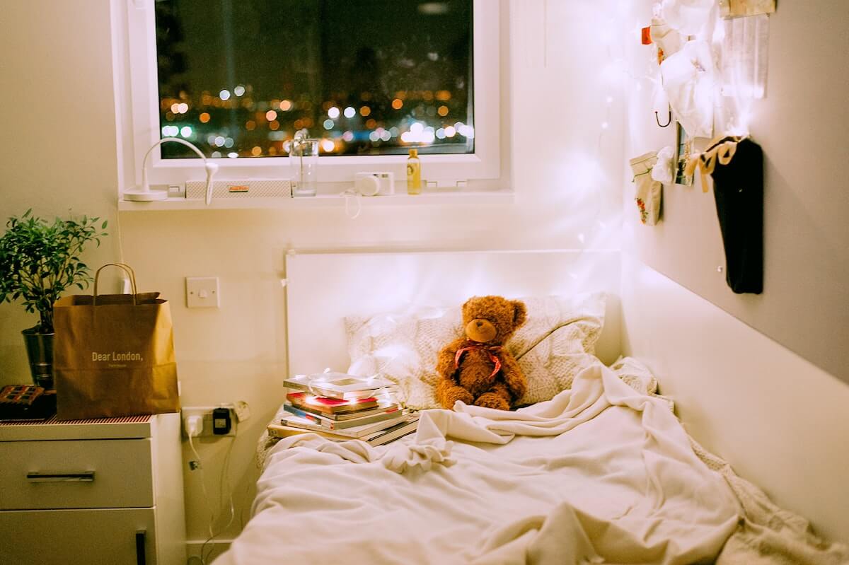 Unsplash: Cute girly empty dorm bed