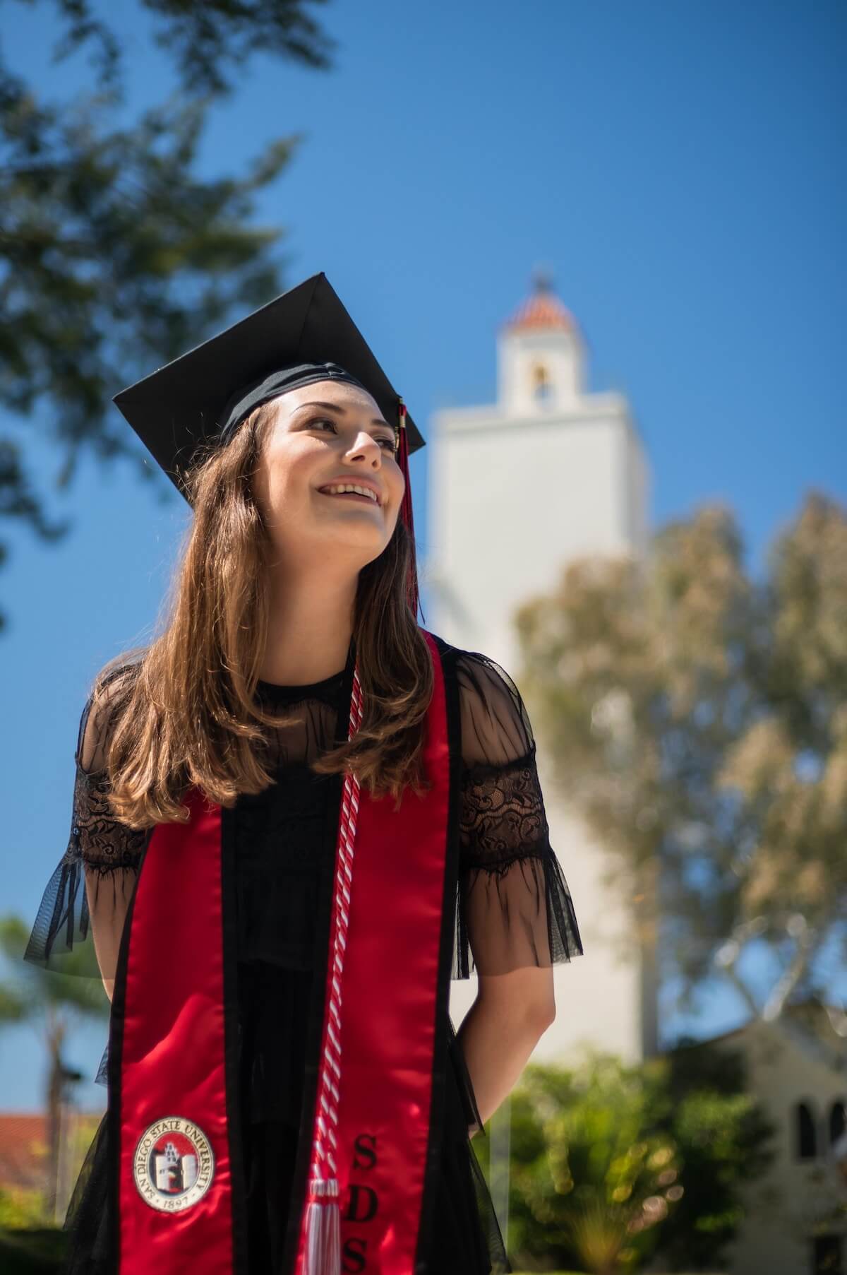 Unsplash: smiling woman graduating college