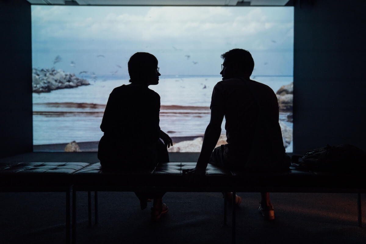 Unsplash Woman and man talking at aquarium etienne boulange