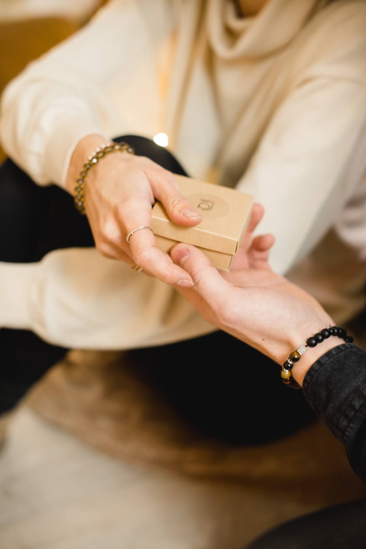 Unsplash Hands Exchanging gift  Kateryna Hliznitsova