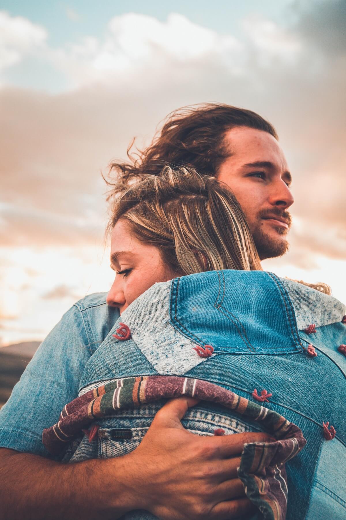 Unsplash Man and woman embracing against sunset Kenny Aliason