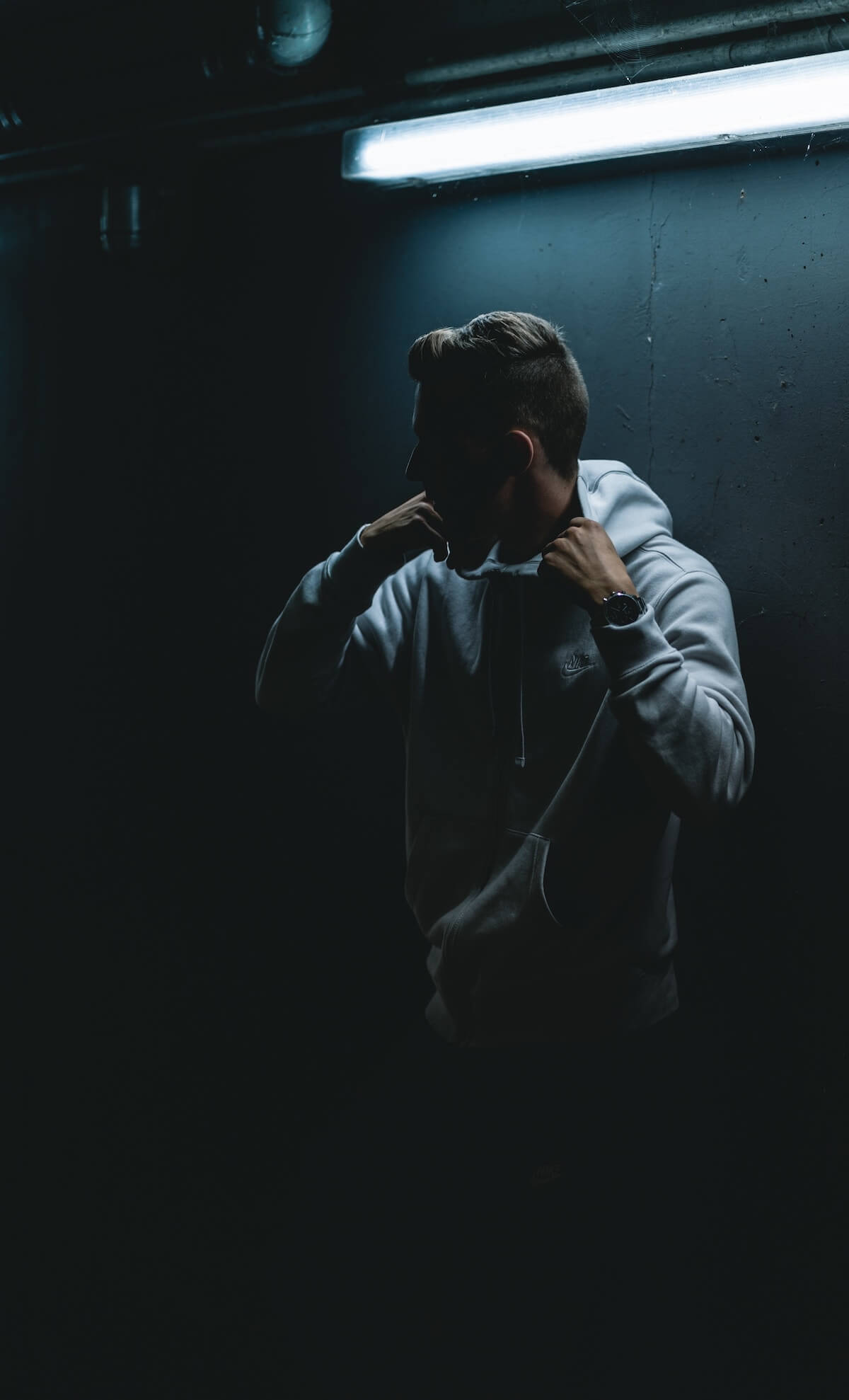Unsplash Man in hoodie obscured by darkness Philipp Lansing