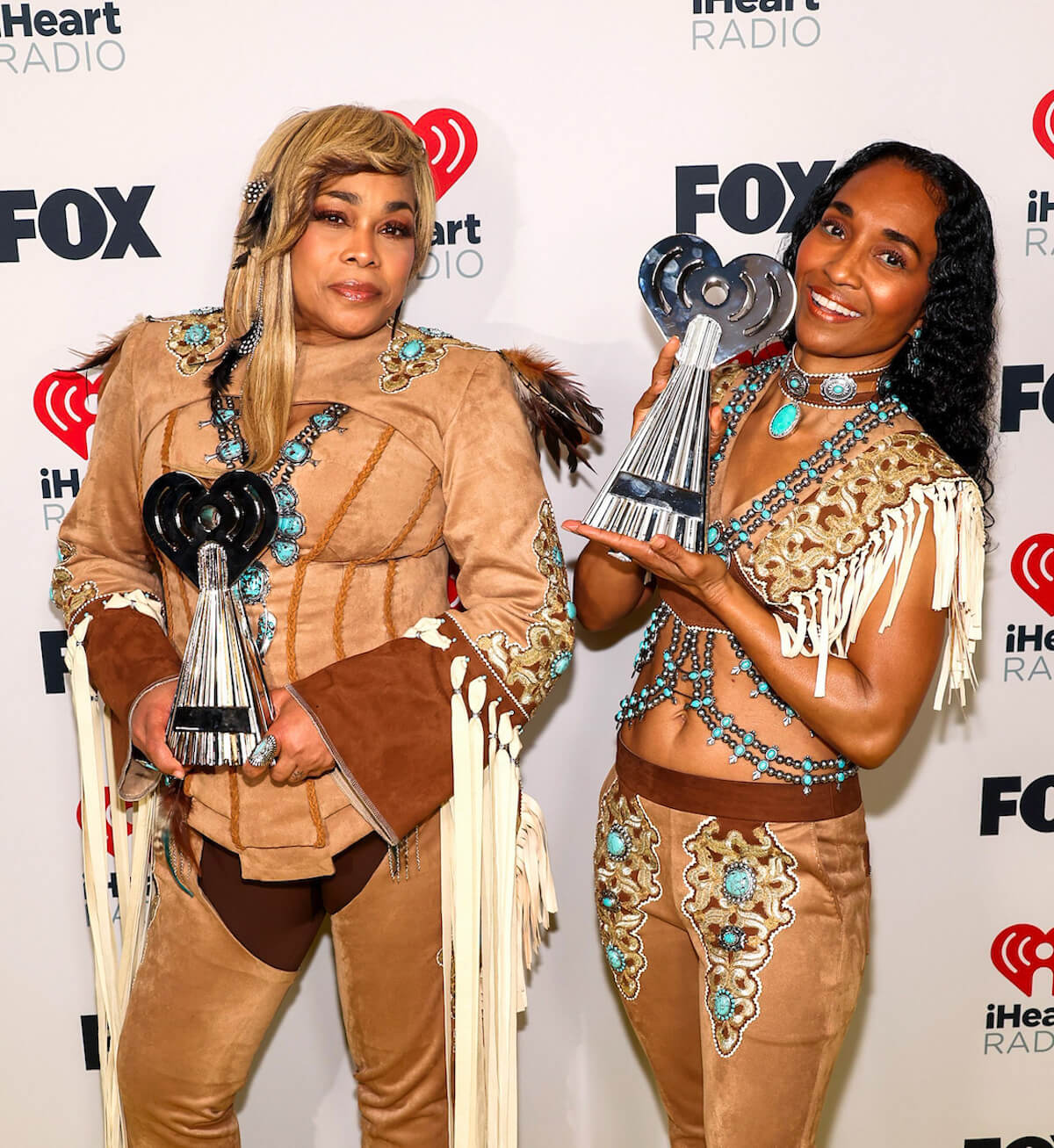 LOS ANGELES, CALIFORNIA - APRIL 01: (FOR EDITORIAL USE ONLY) (L-R) Tionne "T-Boz" Watkins and Rozonda "Chilli" Thomas of TLC, winners of the Landmark Award, attend the 2024 iHeartRadio Music Awards at Dolby Theatre in Los Angeles, California on April 01, 2024. Broadcasted live on FOX. (Photo by Jesse Grant/Getty Images for iHeartRadio)