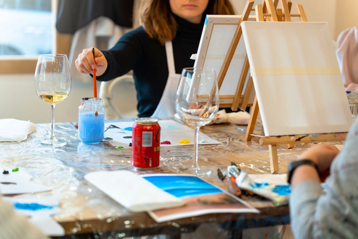 Shutterstock: Sip and Paint Event. Mixing blues.