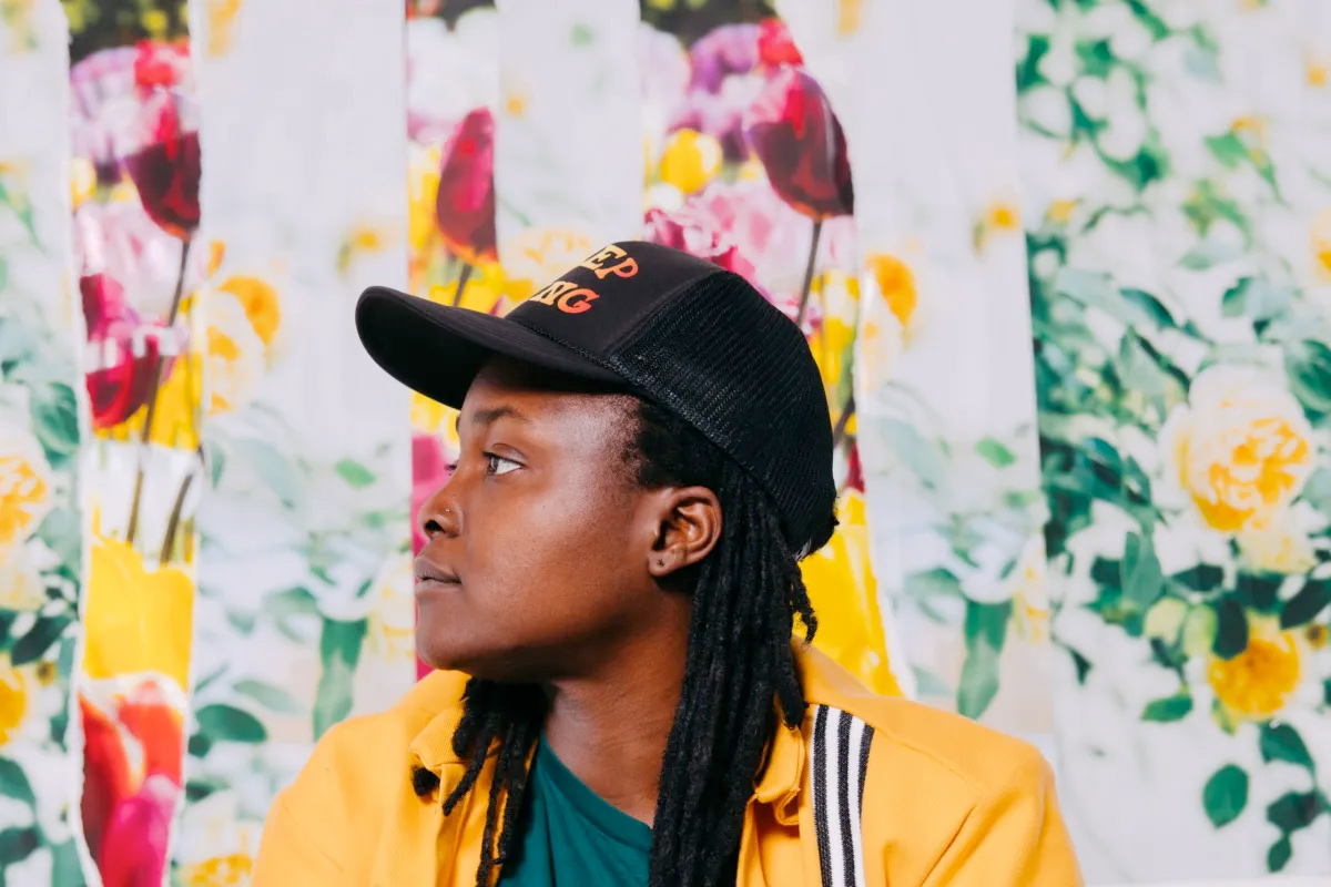 Joy Oladokun in black cap