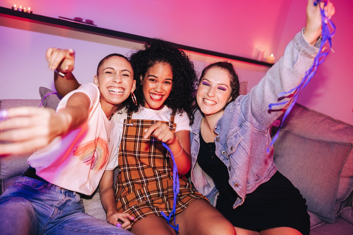 three young women at a party