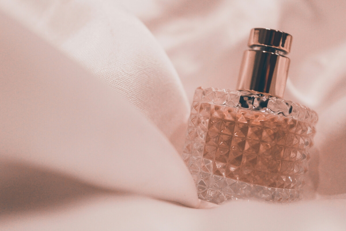 perfume bottle in sheets