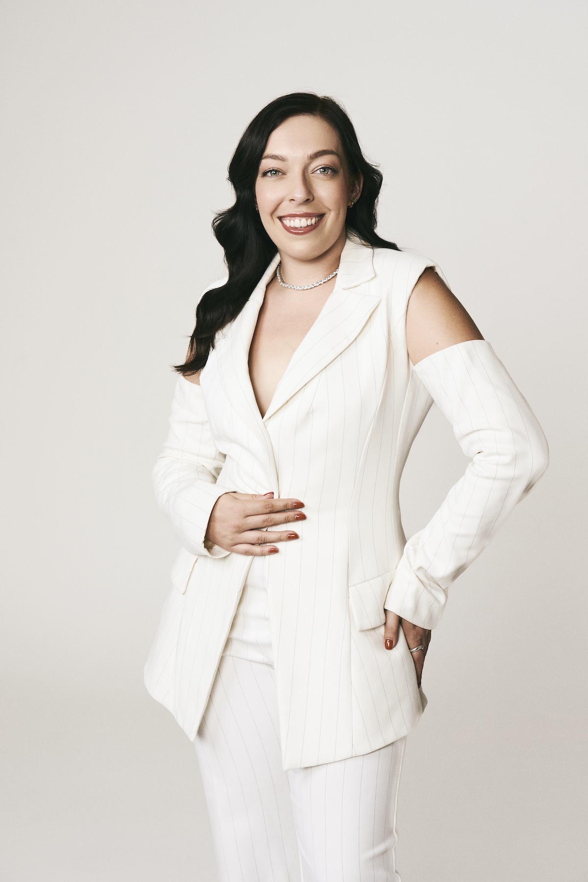 Amanda Golka in white suit outfit