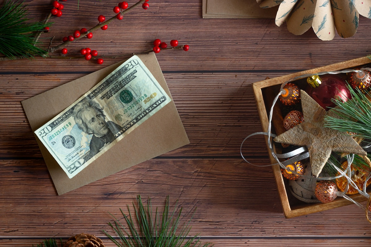 Unsplash: buying holiday gifts with cash by Michelle Henderson