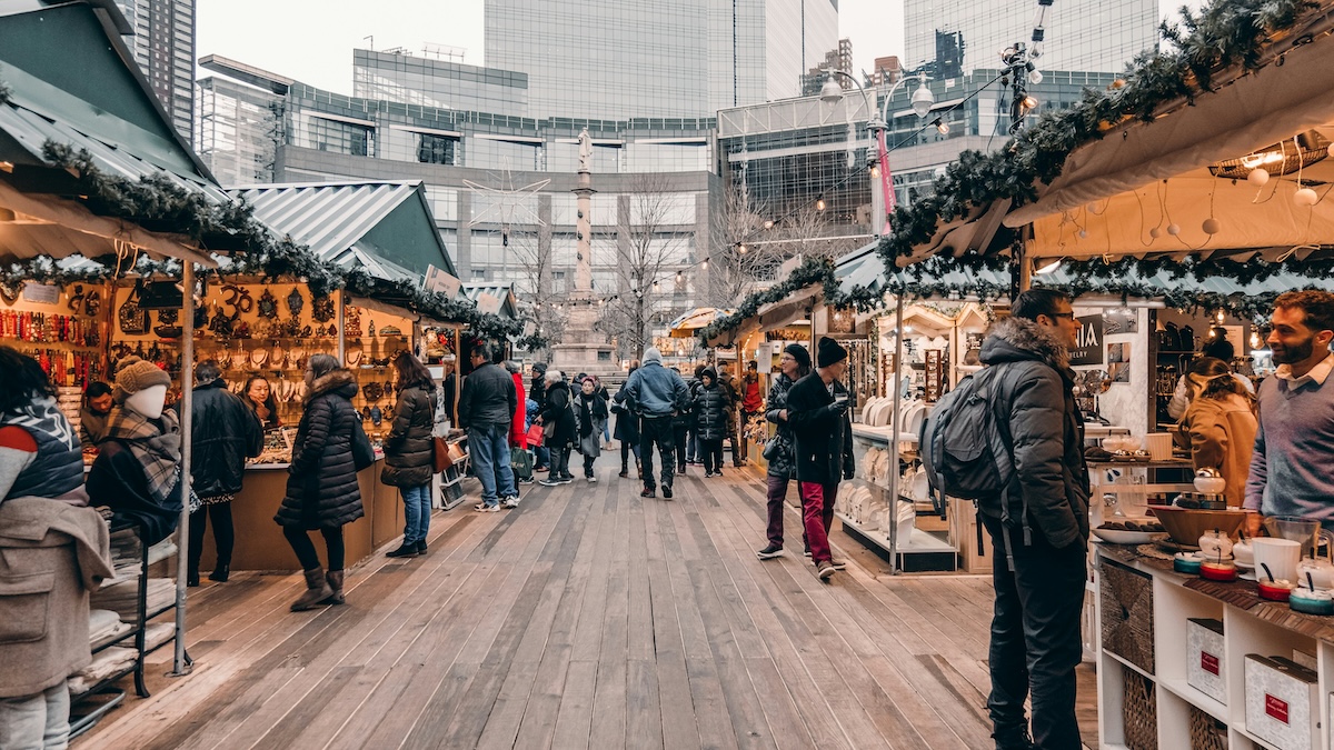 Unsplash: Shopping at outdoor holiday market by Kayla Kaupanger